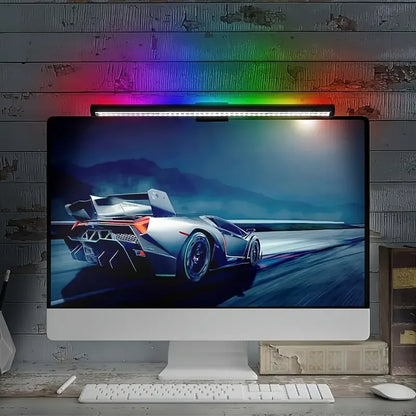 Glow Bar RGB backlight painting the wall behind a monitor