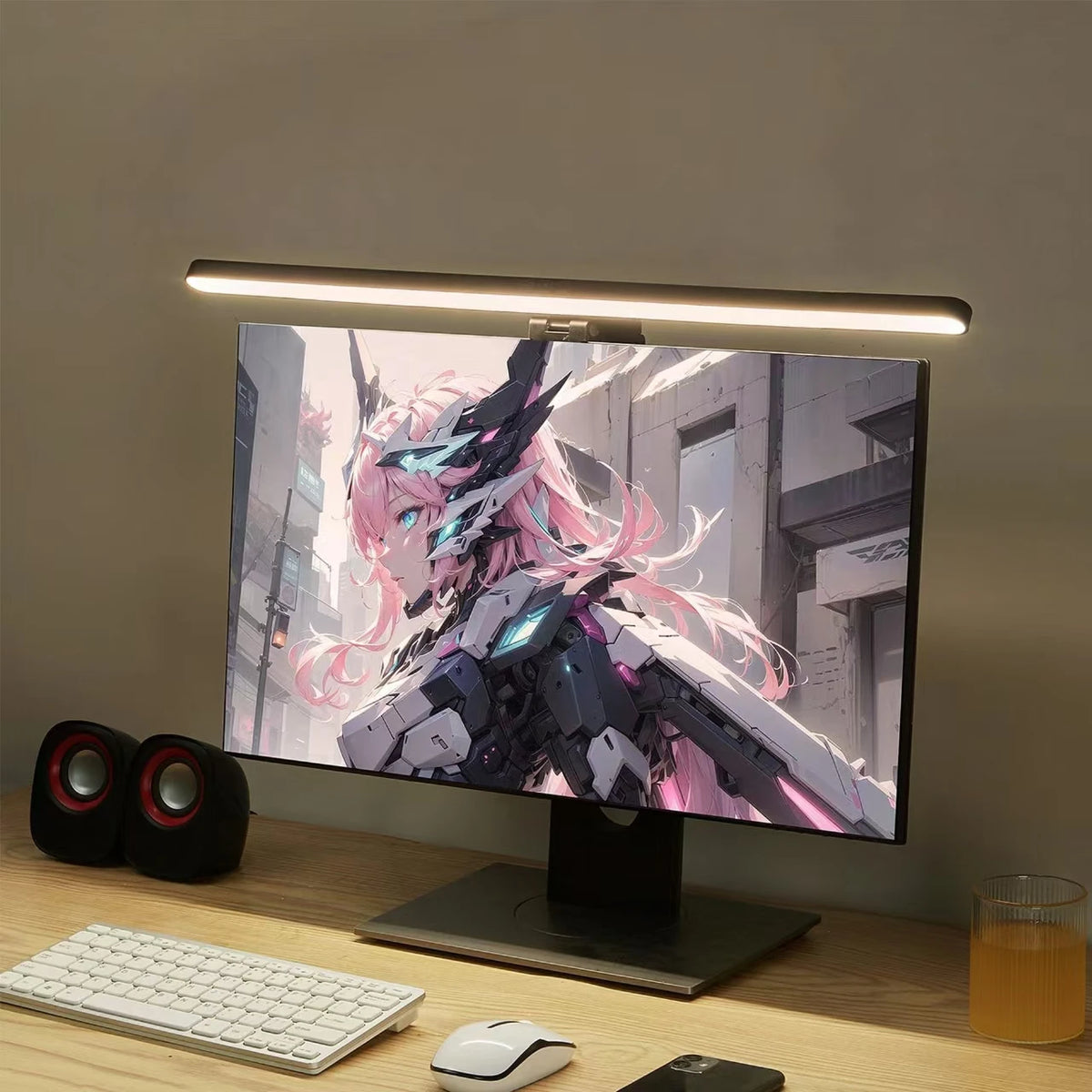 Voltek Glow Bar monitor light bar clipped to the top of a gaming monitor lighting the desk